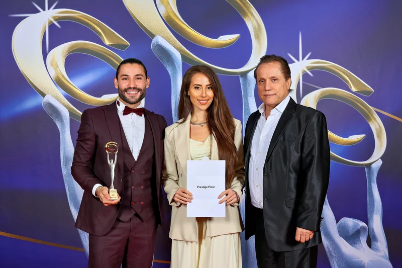 Family with award certificate