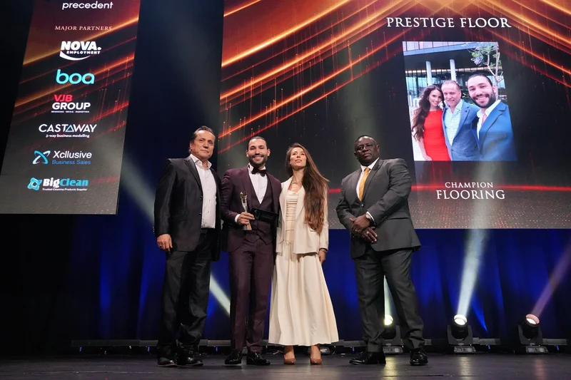 On stage accepting award